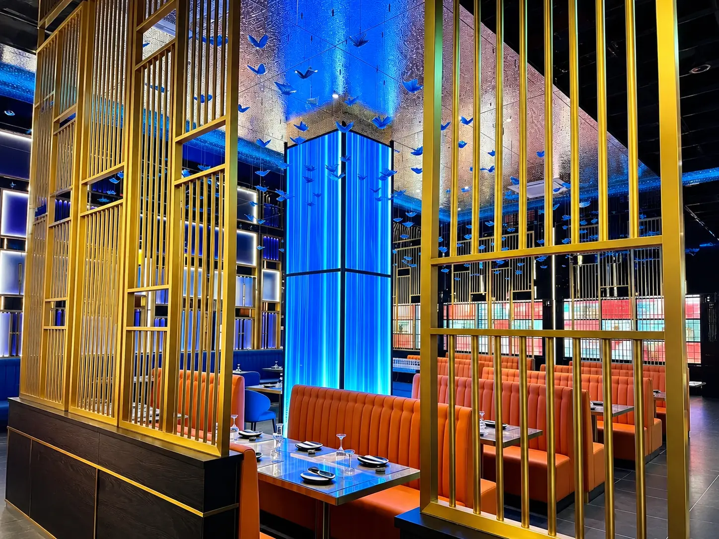 Sushi King main dining room with premium lighting and gold architectural details